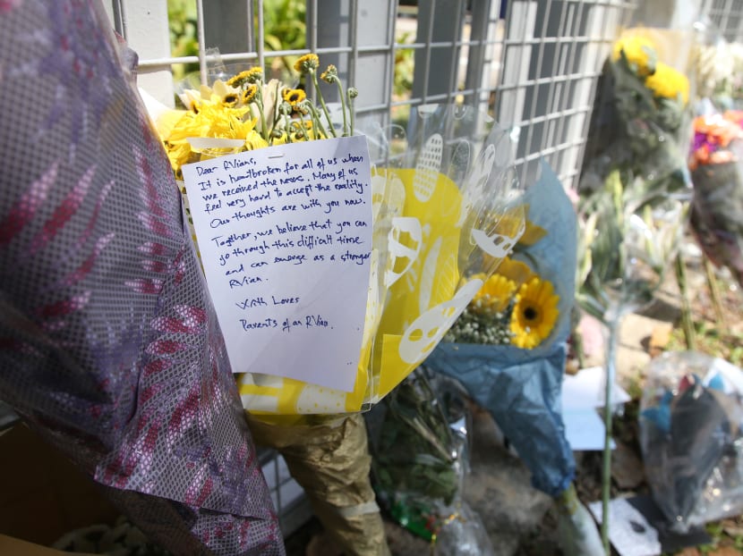 A message offering encouragement and support was seen on a bouquet of flowers placed at the main gate of River Valley High School on July 25, 2021.