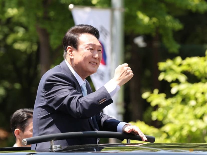 South Korea's new president Yoon Suk-Yeol waves to his supporters while leaving after attending his inauguration ceremony at the National Assembly in Seoul, South Korea, May 10, 2022. 