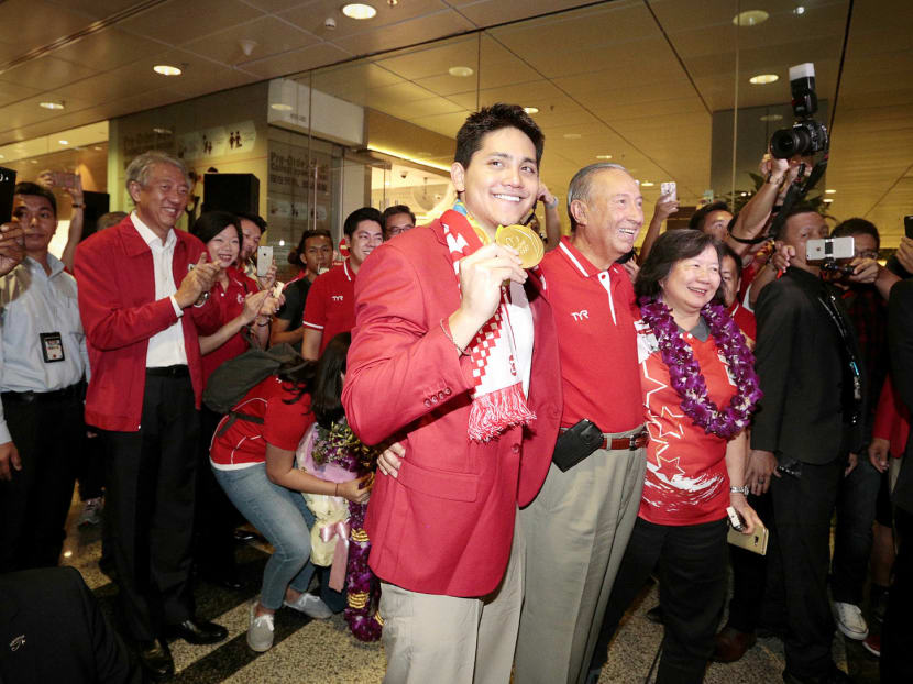 Joseph Schooling with his parents at Changi Airport last year after winning Olympic gold in the 100m butterfly. Mrs May Schooling says the initial focus of the new academy will be on establishing its own swim school. TODAY file photo