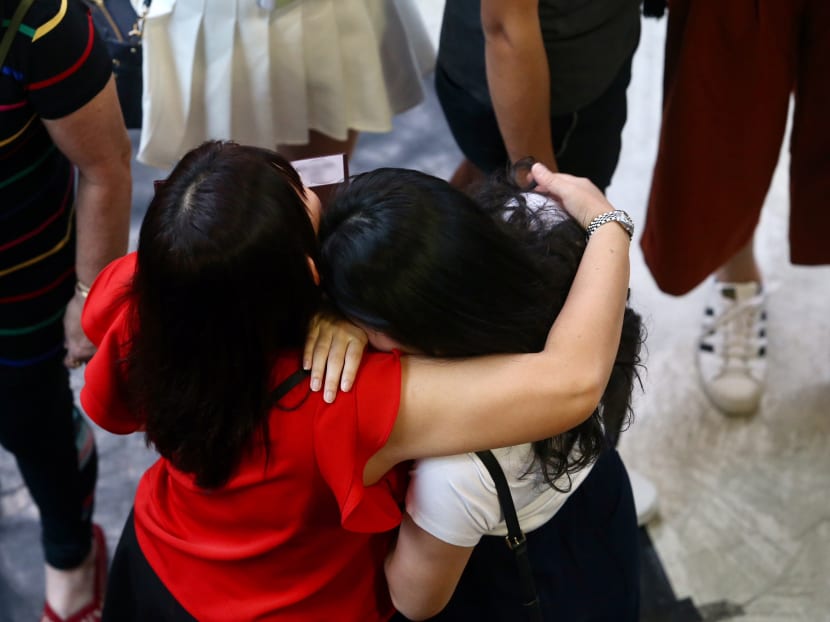 TODAY file photo of a student being consoled at Nanyang JC after receiving a slip of paper informing them of a briefing that they were affected by the theft of the GCE A-Level H2 Chemistry paper 3 examination scripts.