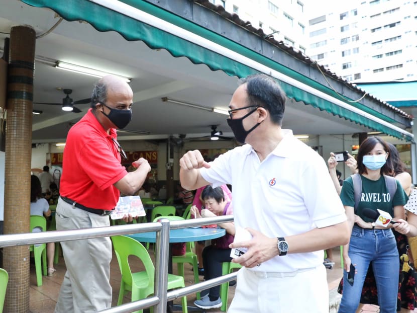 Singapore Democratic Party’s candidate for Bukit Panjang SMC, Dr Paul Tambyah, bumped into Mr Liang Eng Hwa during a walkabout on July 1, 2020.