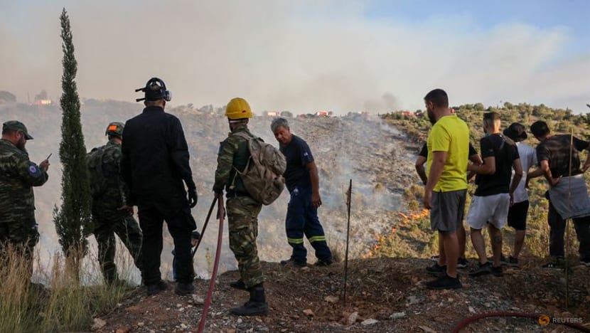 Wildfire rages near Athens, damaging homes Wildfire rages near Athens, damaging homes