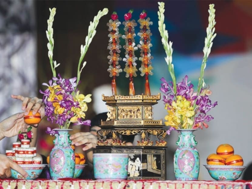The chanap is a Peranakan display of preserved half-ripe papaya carved in the shape of crabs and flowers that are placed on an decorated box. Photo: The Malay Mail Online