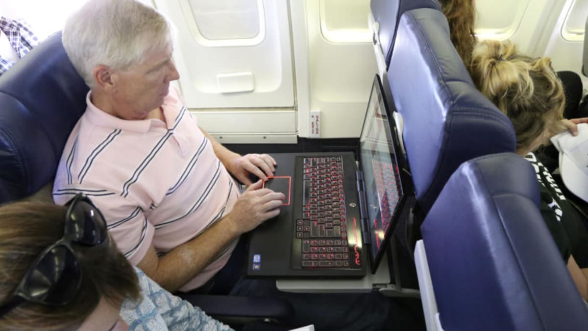 An overheated laptop battery on board could cause fire, plane crash
