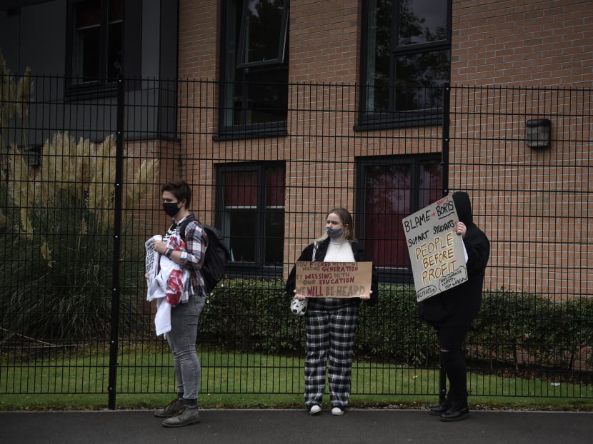 Students hold a small demonstration outside Birley Halls of residence at Manchester Metropolitan University in Manchester, England, where many have been placed under a severe lockdown, on Oct 2, 2020.