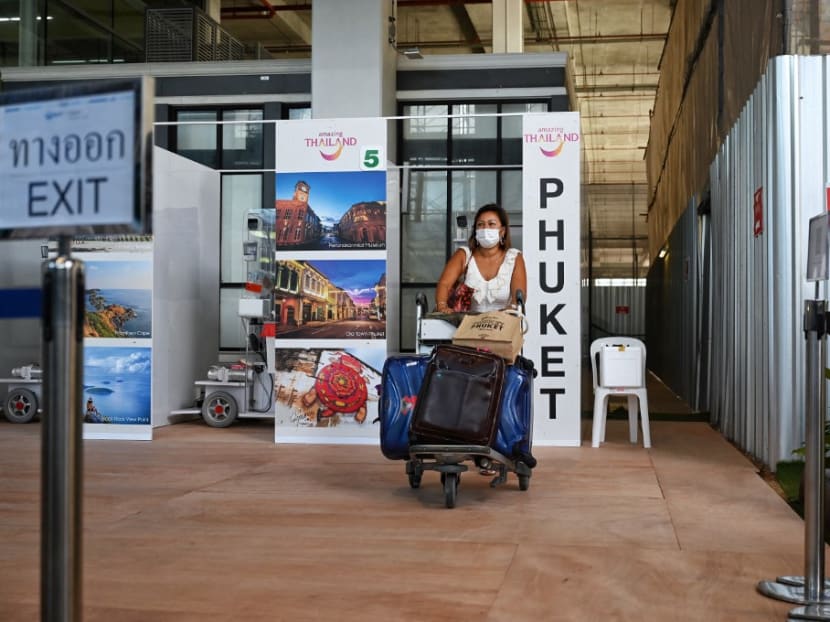 An international passenger arrives at Phuket International Airport in Thailand on July 1, 2021 for the “Phuket Sandbox” tourism scheme that allows vaccinated visitors.