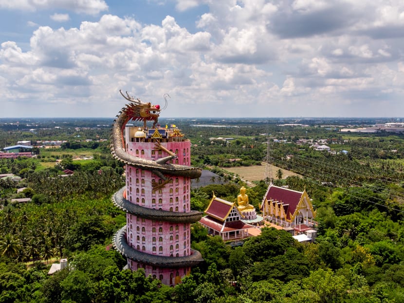 This aerial file photo taken on Sept 11, 2020 shows the Buddhist temple Wat Samphran (Dragon Temple) in Nakhon Pathom, some 40km west of Bangkok. A dragon encircles a tower, wretched souls face torture, superheroes scale a mosiac wall — these may seem like scenes from a half-remembered dream, but are in fact famed temples in Thailand.