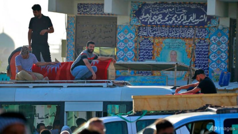 Families lay loved ones to rest after deadly Baghdad blast Families lay loved ones to rest after deadly Baghdad blast