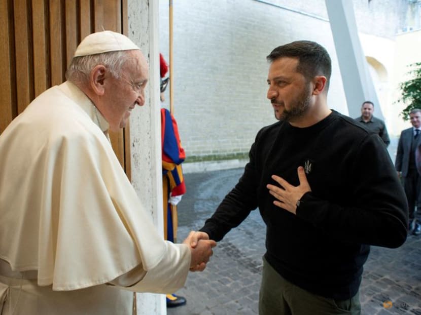 FILE PHOTO: Pope Francis meets with Ukrainian President Volodymyr Zelenskiy, at the Vatican, May 13, 2023. Vatican Media/­Handout via REUTERS  