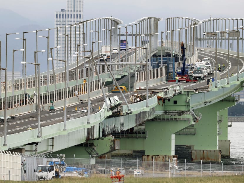 Photo of the day: Work to remove a damaged section of the bridge connecting Kansai International Airport, on an artificial island in Osaka Bay, with the mainland under way on Wednesday (Sept 12). The bridge was severely damaged when a tanker drifted and crashed into it amid a powerful typhoon that hit western Japan on Sept 4.
