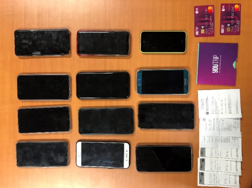 Twelve mobile phones, several YouTrip Mastercards and ATM withdrawal receipts were seized by police as case exhibits.