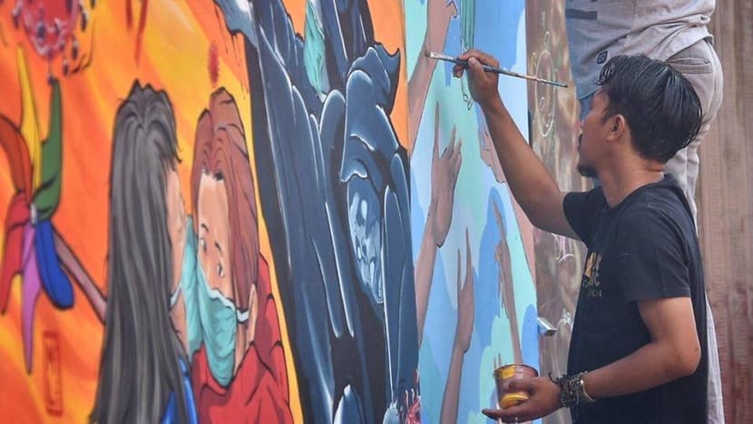 Livelihoods hit by COVID-19, Indonesian mural artists channel efforts towards positive messages