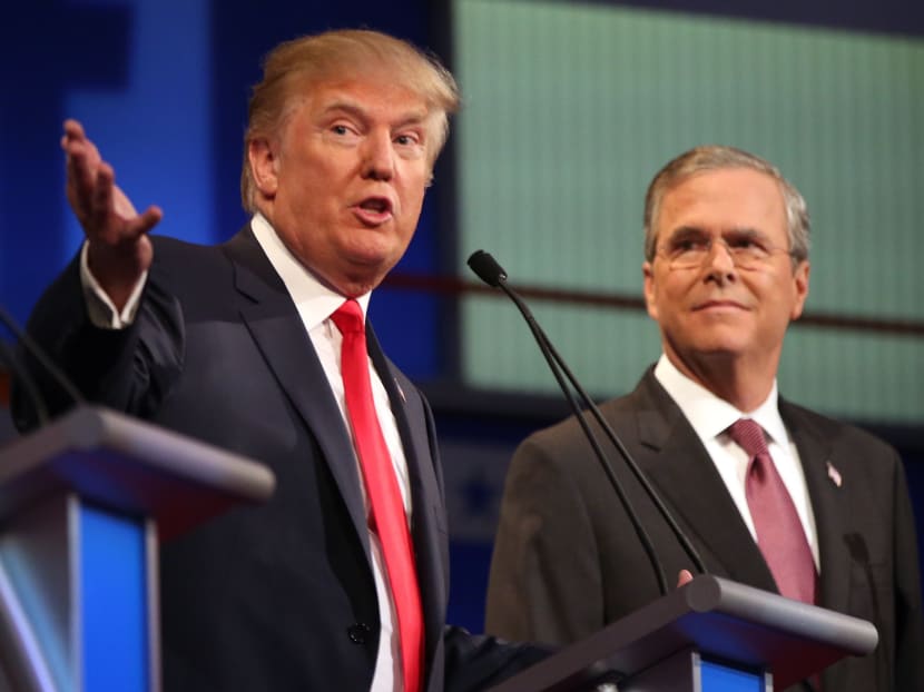 In this Aug 6, 2015, file photo, Republican presidential candidates Donald Trump and Jeb Bush participate in the first Republican presidential debate at the Quicken Loans Arena in Cleveland. Photo: AP