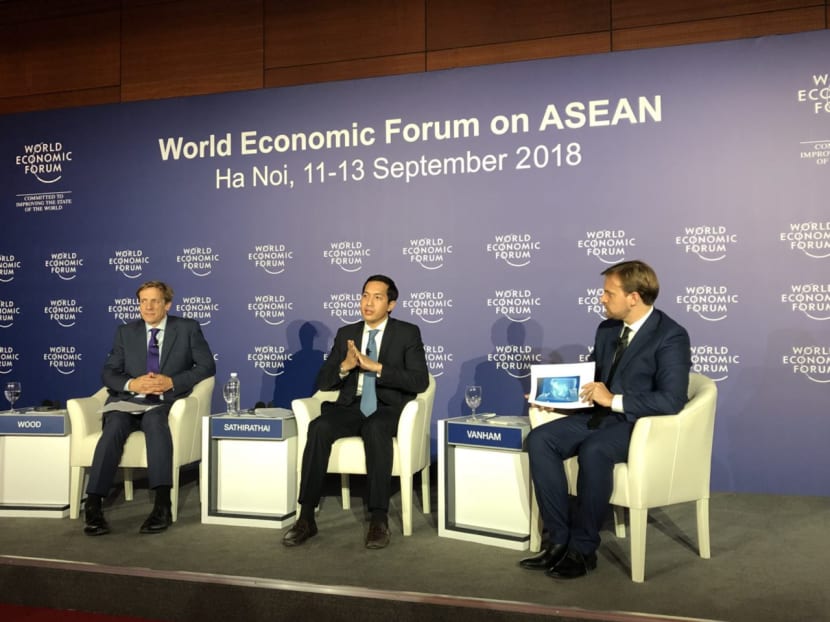 Mr Justin Wood (left), head of regional strategies for the Asia-Pacific with the World Economic Forum, and Mr Santitarn Sathirathai (centre), group chief economist of regional Internet firm Sea, announcing survey findings at a press conference in Hanoi on Sept 11, 2018. Moderating the briefing is Mr Peter Vanham (right), the World Economic Forum’s media lead for the United States and industries.