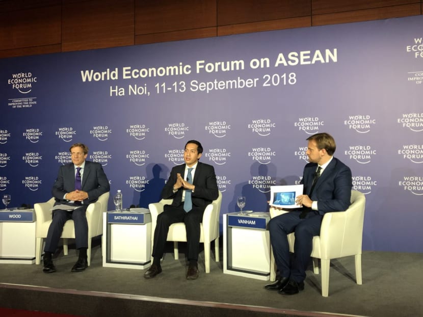 Mr Justin Wood (left), head of regional strategies for the Asia-Pacific with the World Economic Forum, and Mr Santitarn Sathirathai (centre), group chief economist of regional Internet firm Sea, announcing survey findings at a press conference in Hanoi on Sept 11, 2018. Moderating the briefing is Mr Peter Vanham (right), the World Economic Forum’s media lead for the United States and industries. Mr Justin Wood (left), head of regional strategies for the Asia-Pacific with the World Economic Forum, and Mr Santitarn Sathirathai (centre), group chief economist of regional Internet firm Sea, announcing survey findings at a press conference in Hanoi on Sept 11, 2018. Moderating the briefing is Mr Peter Vanham (right), the World Economic Forum’s media lead for the United States and industries.