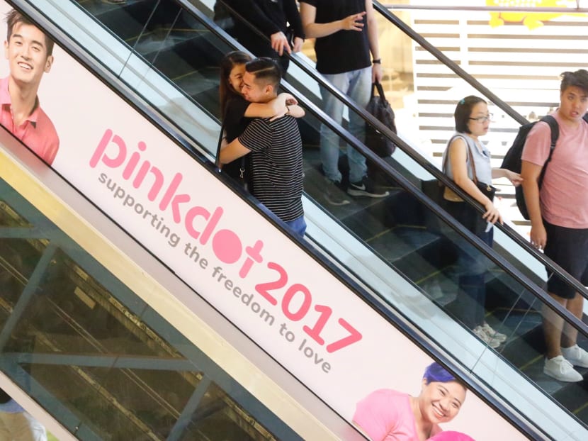 The Advertising Standards Authority of Singapore has asked mall manager Cathay Organisation Holdings to remove the line, ‘Supporting the freedom to love’, from the banner which has been put up since May 31 on an escalator in the building. Photo: Najeer Yusof/TODAY