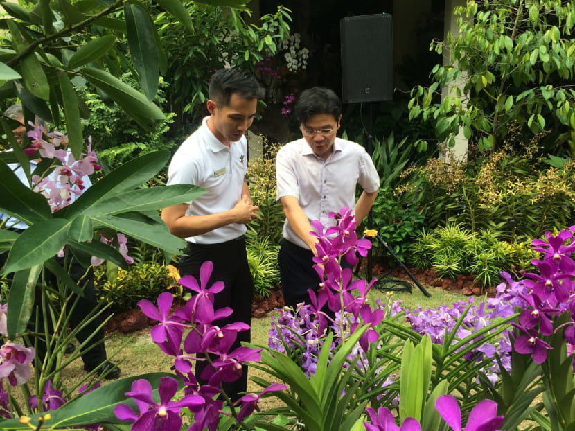 Mr Simon Tan, Assistant Director of Horticulture, Events & Exhibitions at Singapore Botanic Gardens with Mr Lawrence Wong, Minister for Culture, Community and Youth and Second Minister for Ministry of Communications and Information at the new exhibition called "Botanical Inspirations" launch today, July 10, 2015. Photo: Constance Yeo