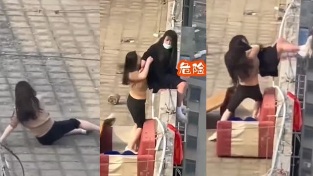中国女子危坐楼顶欲轻生 闺蜜装受伤见机营救获赞