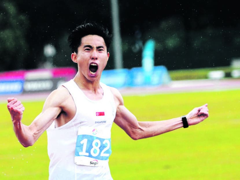 Soh celebrating his victory in the SEA Games men’s marathon at East Coast Park on June 7. He has set his sights on next year’s Rio Olympics. Photo: Reuters