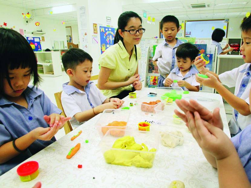 A teacher and kids at play at PCF Sparkletots at Punggol West. Photo: Ooi Boon Keong