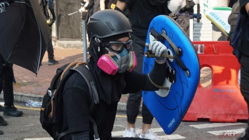 Hong Kong protester shot by police charged with rioting and assault