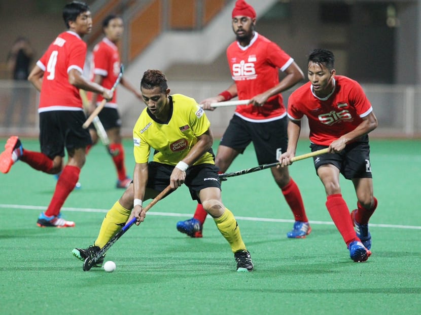 World Hockey League 2015 match between Singapore (red) and Malaysia (yellow) at the Sengkang Sports Complex. Photo: