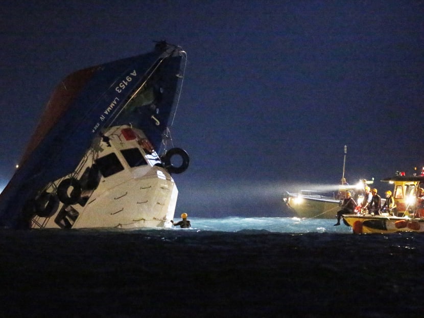 In this Oct 2, 2012 file photo, rescuers check on a half submerged boat after it collided near Lamma Island, off the southwestern coast of Hong Kong. Photo: AP