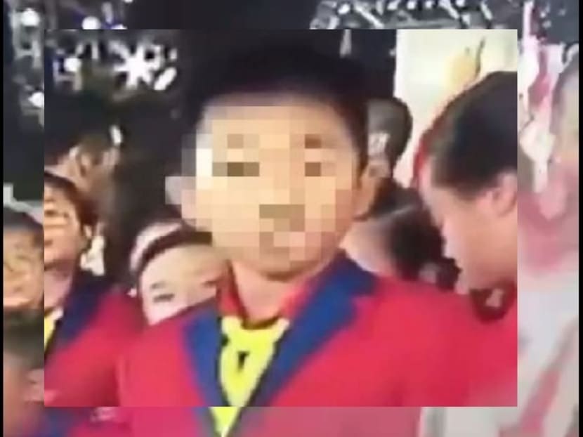 A screengrab of the boy who was caught making a rude gesture during the live telecast of the National Day Parade on Wednesday (Aug 9).