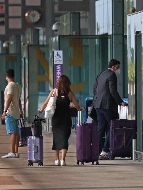 File photo of travellers at Changi Airport Terminal 3 on Oct 19, 2021.