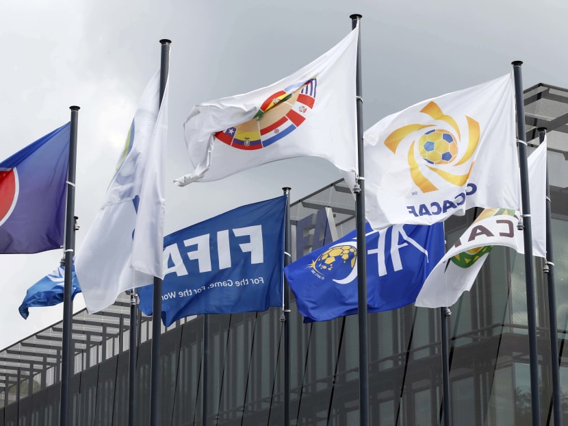 Flags are pictured in front of the headquarters of soccer's international governing body FIFA in Zurich, Switzerland. Photo: Reuters
