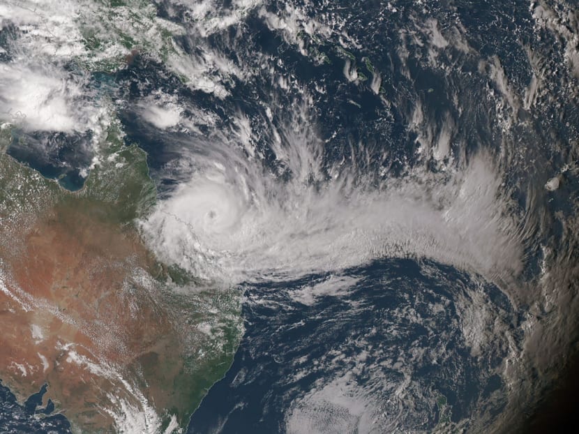 Tens of thousands forced to flee their homes as cyclone slams into Queensland