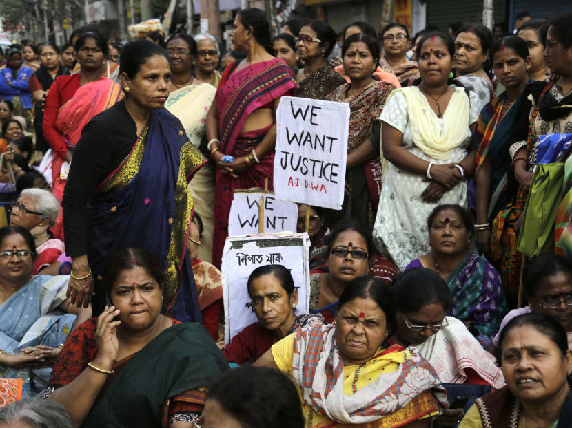 Women activists participate in a demonstration demanding highest punishment for convicted persons in the Kamduni rape case and the re-arrest of two acquitted persons near the city court in Kolkata, India, Friday, Jan. 29, 2016. Photo: AP