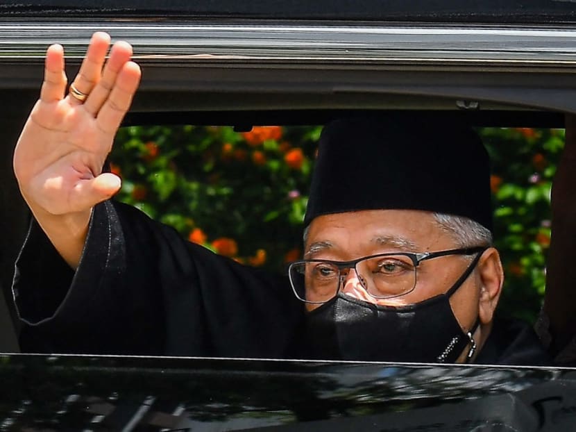 Malaysia's Prime Minister Ismail Sabri Yaakob waving as he leaves his house on the way to taking the oath of office to become the country's new leader in Kuala Lumpur.