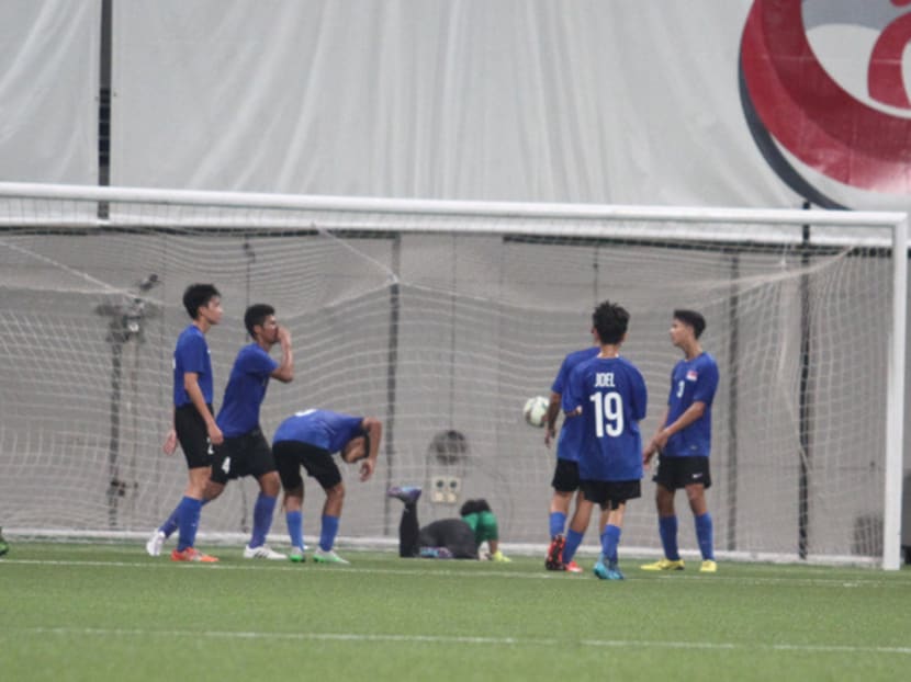 Singapore (in blue) lost 5-0 to Thailand on Wednesday. They face North Korea tonight. Photo: Jaslin Goh