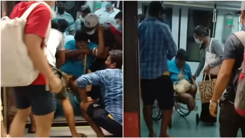 Commuters, SMRT staff free woman in wheelchair from platform gap at Botanic Gardens MRT station Commuters, SMRT staff free woman in wheelchair from platform gap at Botanic Gardens MRT station