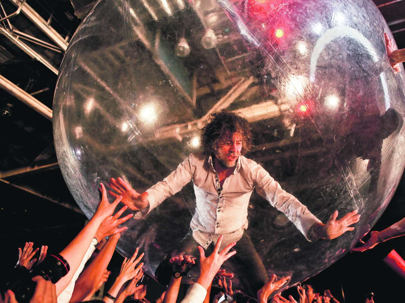 Flaming Lips frontman Wayne Coyne performing at their last show in Singapore in 2010. TODAY file photo
