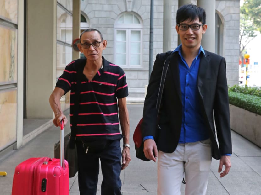 Mr Roy Ngerng (black) arriving at Supreme Court on July 2, 2015. Photo: Wee Teck Hian
