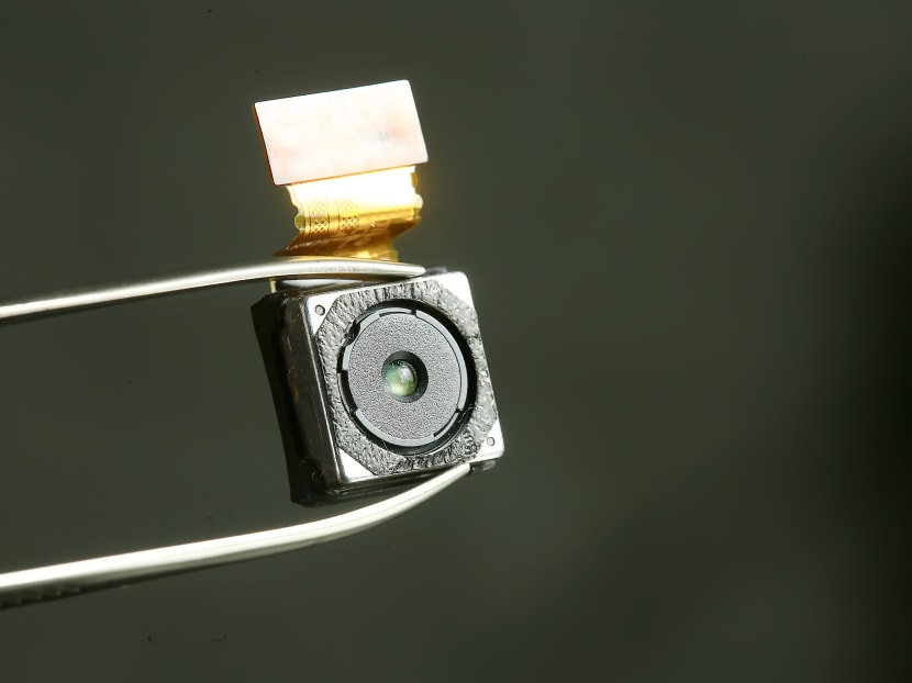 A close-up of a mini spy camera.