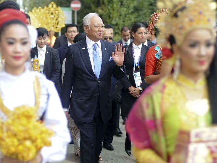 Malaysian Prime Minister Najib Razak (C) remains under global pressure over the controversial 1MDB. Photo: Reuters