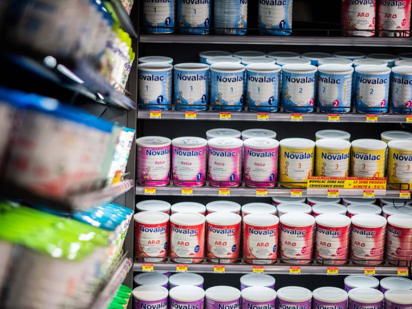 Powdered baby milk tins being displayed at a pharmacy in Paris. Powdered baby milk tins being displayed at a pharmacy in Paris.