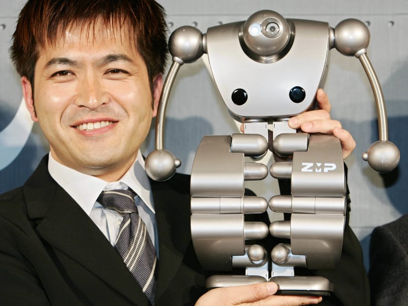 President of Japan's robot venture ZMP Hisashi Taniguchi introduces its humanoid robot 'Nuvo' during a press conference in Tokyo, 12 April 2005. AFP file photo