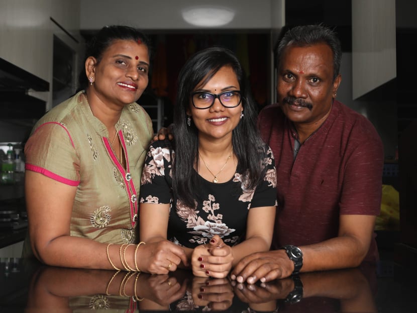 Ms R Abirami (seen here with her parents) is from a low-income family of six. Her father, a technician, was the family’s sole breadwinner until she joined the workforce five years ago.