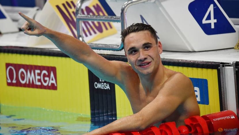 Hungary's Milak smashes own swimming world record, triple gold for US