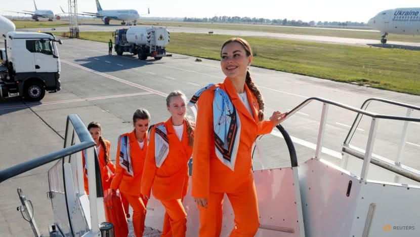 Ukrainian airline ditches skirts and heels for loose suits and sneakers Ukrainian airline ditches skirts and heels for loose suits and sneakers