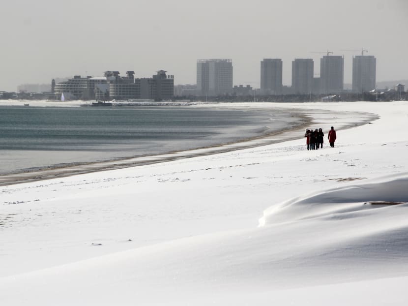 Gallery: Asia shivers, slips and slides in record low temperatures