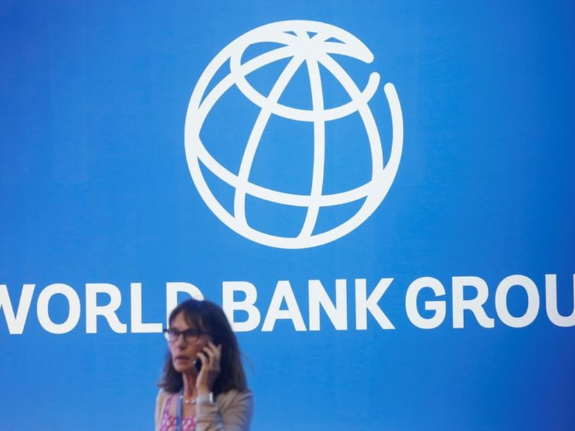 FILE PHOTO: A participant stands near a logo of World Bank at the International Monetary Fund - World Bank Annual Meeting 2018 in Nusa Dua, Bali, Indonesia, October 12, 2018. REUTERS/Johannes P. Christo FILE PHOTO: A participant stands near a logo of World Bank at the International Monetary Fund - World Bank Annual Meeting 2018 in Nusa Dua, Bali, Indonesia, October 12, 2018. REUTERS/Johannes P. Christo