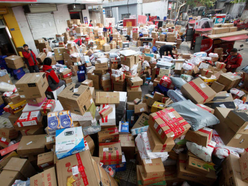 Employees sort boxes and parcels at a JD.com logistic station, after the Singles Day online shopping festival, in Xi'an. Reuters file photo