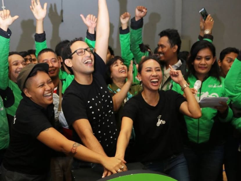 Go-Jek CEO Nadiem Makarim (in glasses) with the company's drivers and staff at a Go-Jek Driver Cup sports competition earlier in 2018. Mr Makarim realised from the start that the drivers were the lifeblood of his business, says the author.