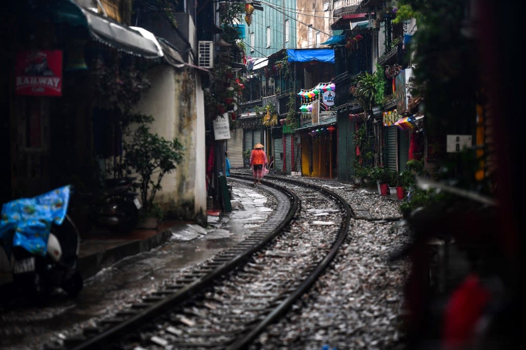 A resident walks on Hanoi's popular train street on Sept 16, 2022, following the announcement of its closure over safety concerns. A resident walks on Hanoi's popular train street on Sept 16, 2022, following the announcement of its closure over safety concerns.