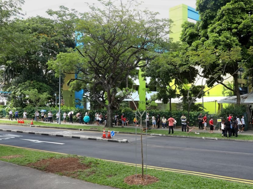 Queues seen outside the former Da Qiao Primary School at Ang Mo Kio, one of the regional screening centres for Covid-19 swab testing, on May 3, 2021.